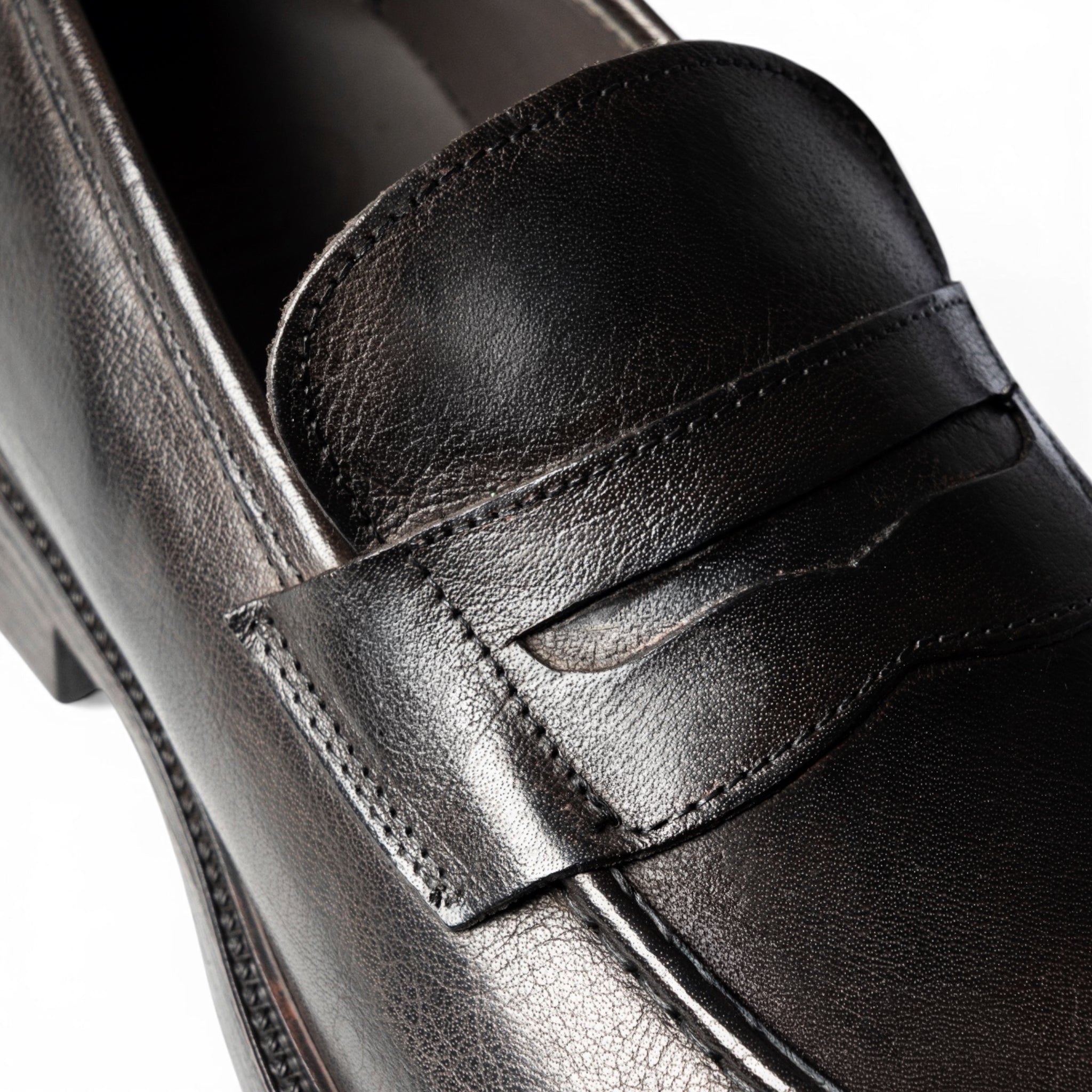 Mocassino penny loafer in pelle testa di moro