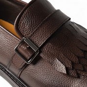 Monk in pelle marrone con frangia e fibbia