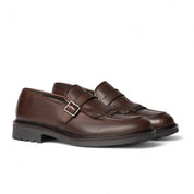 Monk in pelle marrone con frangia e fibbia